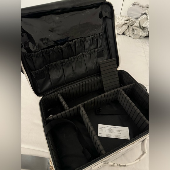 has attachable strap, organizers, holds makeup brushes. many zips & compartments - Picture 2 of 3